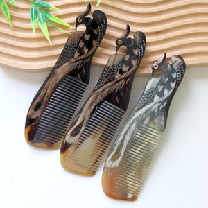 May include: Three hand-carved combs made of horn with intricate bird designs. The combs are black and brown with a natural shine.