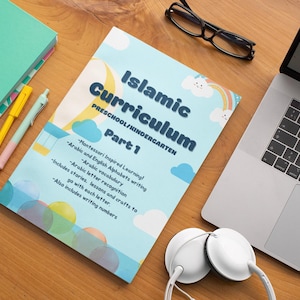 May include: A blue and white book titled "Islamic Curriculum Preschool/Kindergarten Part 1" with colorful illustrations of clouds and rainbows. The book includes Montessori inspired learning, Arabic and English alphabets writing, Arabic letter recognition, Arabic vocabulary, stories, lessons, and crafts.