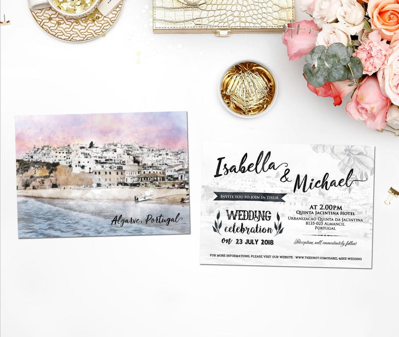May include: Wedding invitation with a watercolor illustration of a coastal town in Algarve, Portugal. The invitation is for Isabella and Michael's wedding celebration on July 23, 2018, at Quinta Jacintina Hotel in Almancil, Portugal.