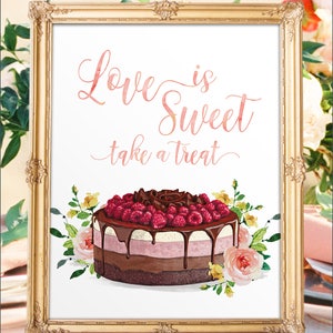 May include: A framed print with the words "Love is Sweet take a treat" in pink script. The image features a watercolor cake with chocolate ganache, raspberries, and floral accents in a gold ornate frame.