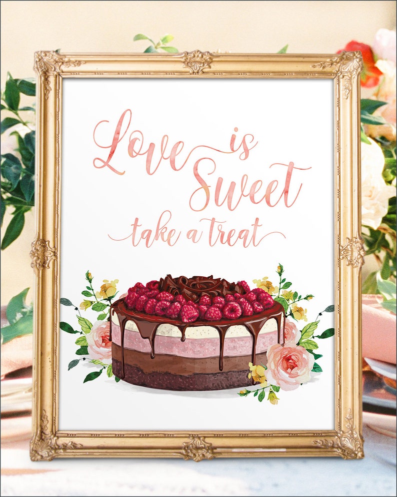 May include: A framed print with the words "Love is Sweet take a treat" in pink script. The image features a watercolor cake with chocolate ganache, raspberries, and floral accents in a gold ornate frame.