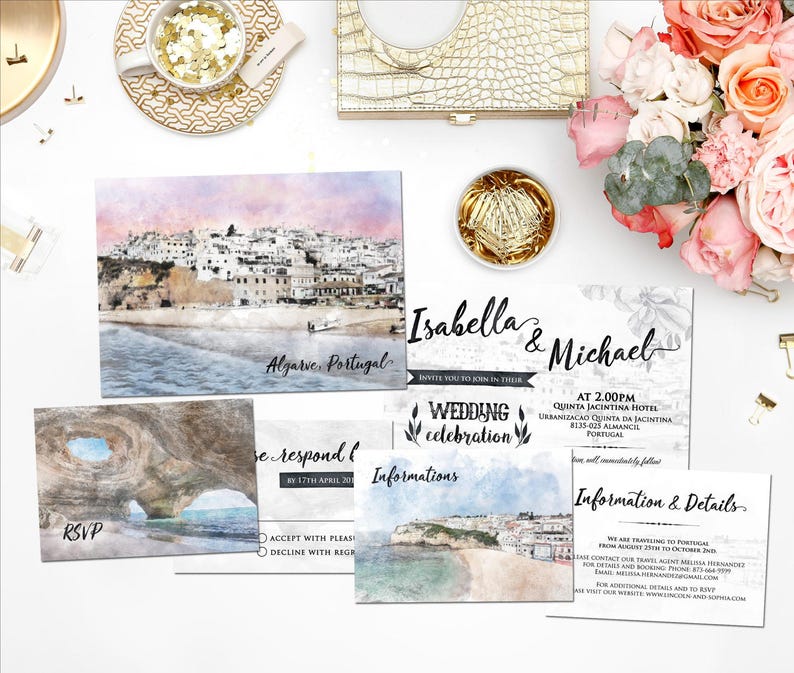 May include: Wedding invitation suite with watercolor illustrations of a coastal town in Portugal. The invitation features the names "Isabella & Michael" and details about the wedding ceremony and reception. The RSVP card includes a watercolor illustration of a cave and the text "RSVP".