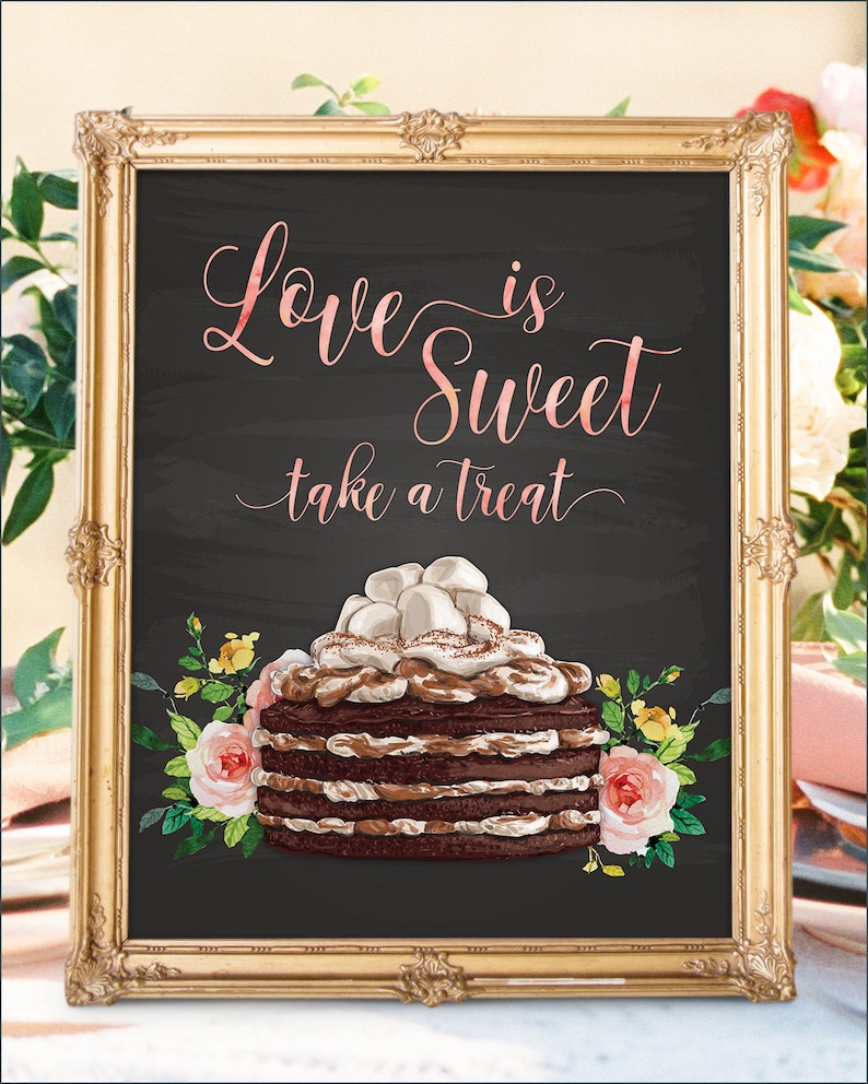 May include: A chalkboard sign with a gold frame and the text "Love is Sweet take a treat" in pink script. A chocolate cake with white frosting and marshmallows is pictured below the text, surrounded by pink and yellow flowers.
