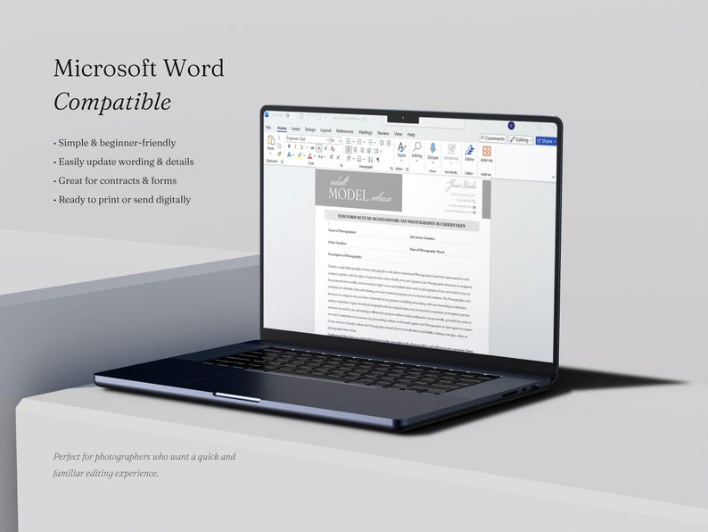 May include: A dark gray laptop displaying a digital model release form document in Microsoft Word. The screen shows text fields for photographer and model details, with the header reading Model Release. The laptop is positioned on a white surface.