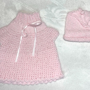 Hand-knit dress and matching bonnet