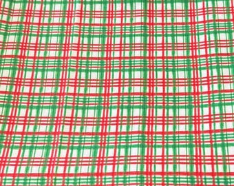 Christmas Countdown Plaid Featuring a Festive Red and Green Crisscross Plaid Pattern on a White Background. Cotton sold by 1/2 Yard