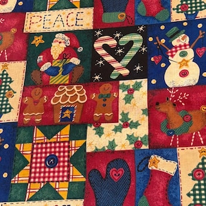 May include: A fabric print featuring a patchwork of holiday-themed squares including snowmen, Santa Claus, gingerbread people, candy canes, stockings, mittens, and stars. The design incorporates red, green, blue, and cream colors with the word PEACE.