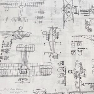 May include: A set of three ceramic mugs with a speckled, matte finish. The mugs are in shades of cream, light gray, and dark gray. Each mug has a simple, minimalist design and a rounded handle.