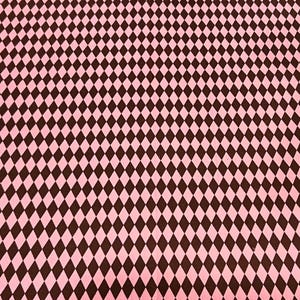 May include: Pink and brown diamond pattern fabric. The fabric features a repeating pattern of brown diamonds set against a pink background. The diamonds are evenly spaced and create a visually appealing design.