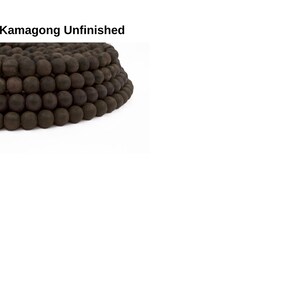 May include: A strand of dark brown wooden beads, unfinished and ready for crafting projects.
