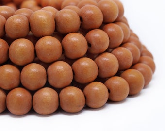 MARKDOWN 70% - 10mm Burnt Orange Round Wood Beads - Dyed and Waxed - 15 inch strand