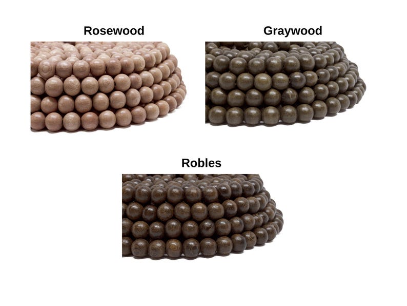May include: Three piles of wooden beads in different colors: rosewood, graywood, and robles. The beads are round and smooth.