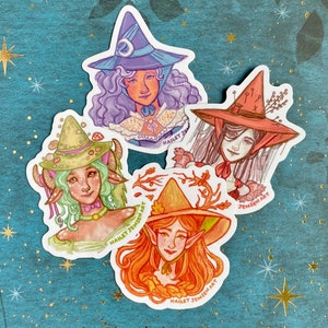 May include: Four whimsical witch stickers. Each sticker features a different witch with unique hats and hairstyles. The witches are in shades of purple, red, green, and orange. The artist's name, Hailey Jensen Art, is printed on each sticker.
