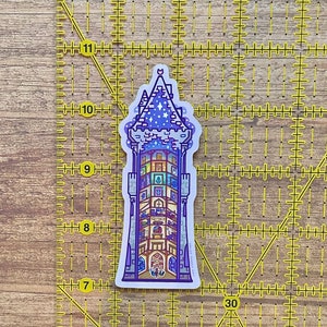 May include: A sticker of a purple and blue tower with a star-filled sky on the roof. The tower has many windows with different colored designs inside. The sticker is about 9 inches tall.