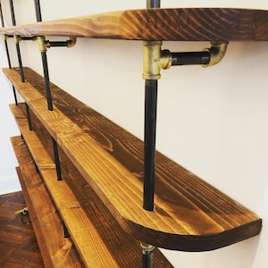 Black Pipe Shelving with Brass Accents