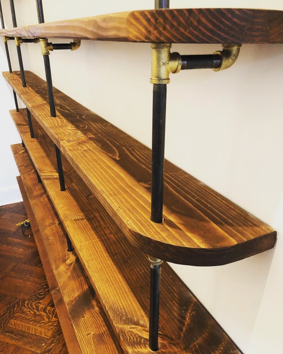 Pipe and outlet plank shelving
