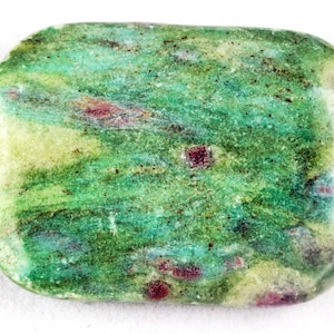 May include: A rectangular gemstone bead with rounded corners. The bead features a mix of green, yellow, and red hues. The green dominates, with streaks and patches of yellow and red throughout. A small hole is visible for stringing.