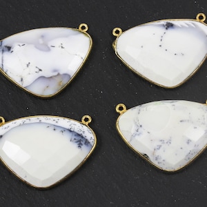 May include: Four white and grey gemstone pendants with gold-coloured metal trim. Each pendant is a triangular shape with a small loop at the top for attaching to a chain or other jewellery component.