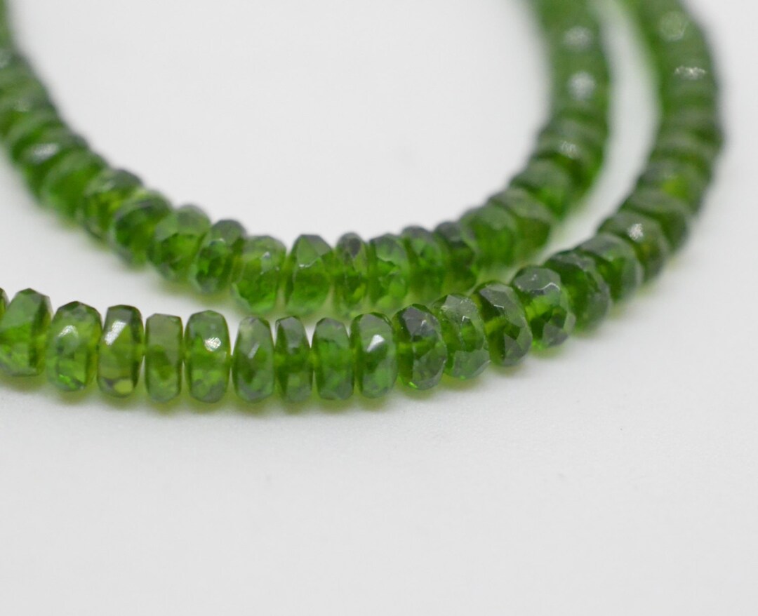 Lot 168 - A Russian green diopside and white sapphire
