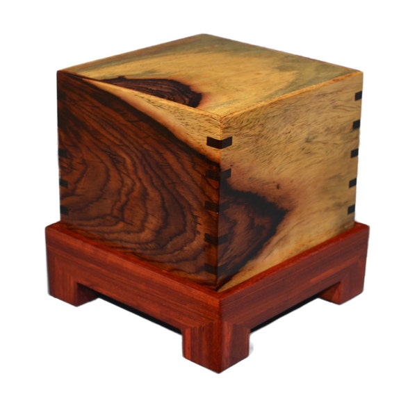 Cocobolo Urn handmade by Westwood Woodworking.  This urn is made from Cocobolo on a Padauk base and has a large amount of sapwood (white).