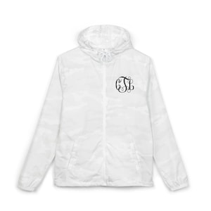 May include: White camouflage hooded jacket with a full-length zipper and a black monogram on the left chest. The jacket has a drawstring hood and long sleeves. The jacket is made of a lightweight material.