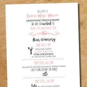 May include: A white wedding itinerary card with black and pink text. The card details a Riviera Maya Mexico wedding, including event times and locations. Decorative elements include hearts and cocktail glasses. The card is on a wooden surface.