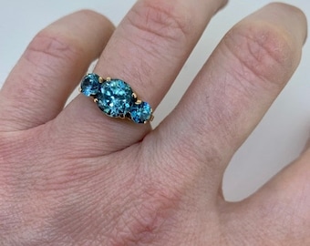Art Deco rose gold blue zircon old cut three stone trilogy ring, size 6