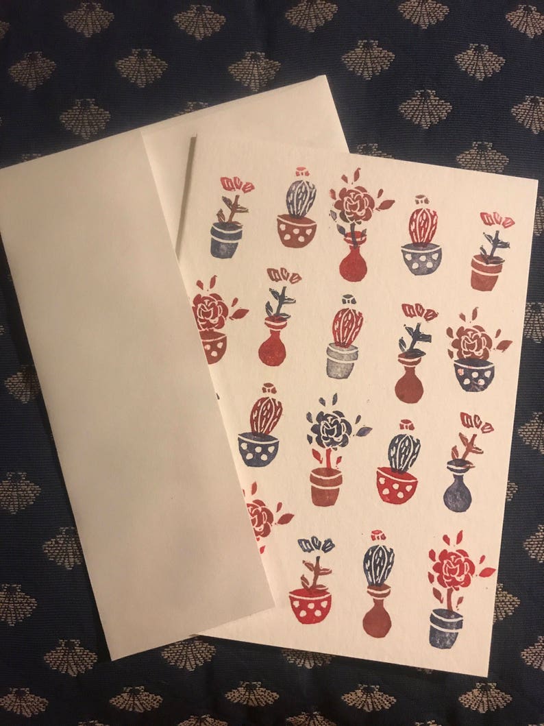 Handprinted card with potted flowers and cactus