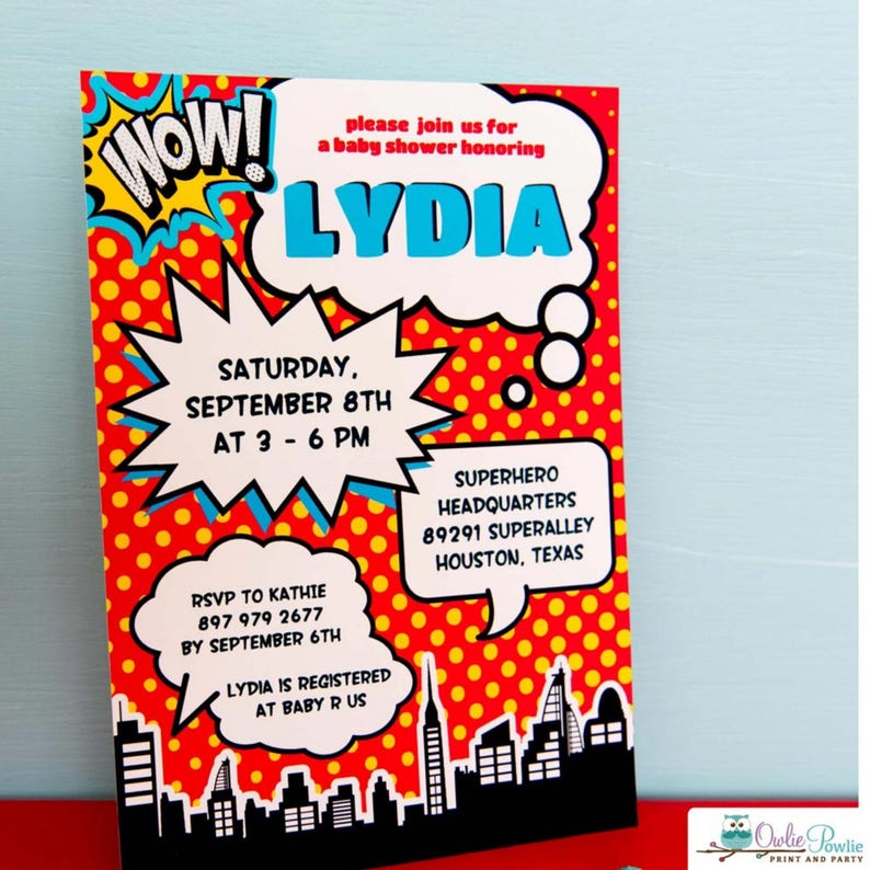 May include: A rectangular baby shower invitation featuring a comic book theme with a red background and yellow polka dots. It includes white speech bubbles containing text: WOW!, please join us for a baby shower honoring LYDIA, date, time, location, and RSVP details, with a black city skyline silhouette at the bottom.