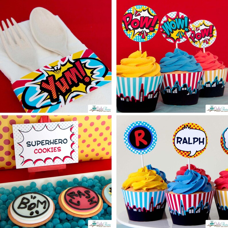 May include: A collection of party supplies featuring comic book themes, including a napkin band with the text YUM!, cupcake wrappers with city skylines, toppers with POW!, WOW!, and RALPH, and a sign labeled SUPERHERO COOKIES with round cookies.