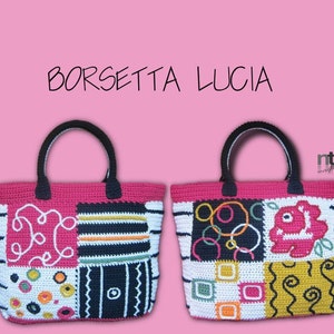 May include: Two crocheted tote bags with colorful geometric patterns. The bags are pink, black, white, yellow, and orange. The text "BORSETTA LUCIA" is at the top of the image.