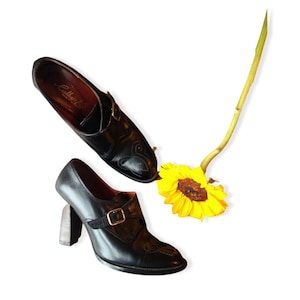 1950s black leather mules // tall black leather mary janes // mid-century embossed heeled buckle shoes // steampunk slip-ons // 8N