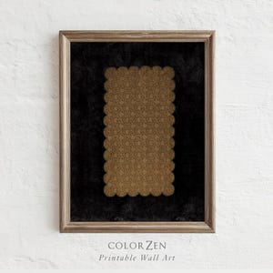 May include: A framed print featuring a rectangular design with a scalloped edge. The design is a repeating pattern in shades of gold, set against a black background. The frame is a light brown color. The text "COLOR ZEN Printable Wall Art" is at the bottom.