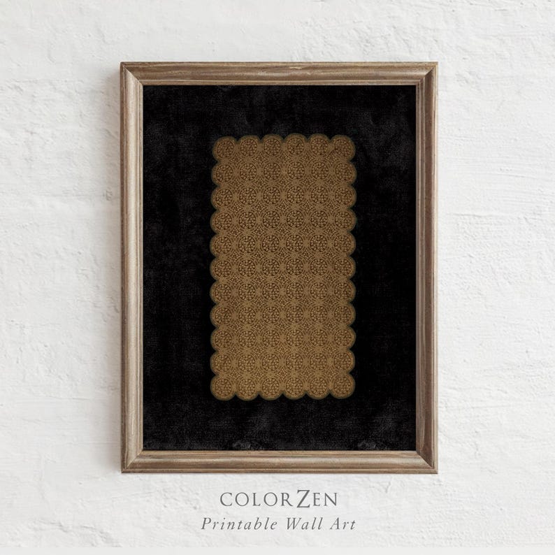 May include: A framed print featuring a rectangular design with a scalloped edge. The design is a repeating pattern in shades of gold, set against a black background. The frame is a light brown color. The text "COLOR ZEN Printable Wall Art" is at the bottom.