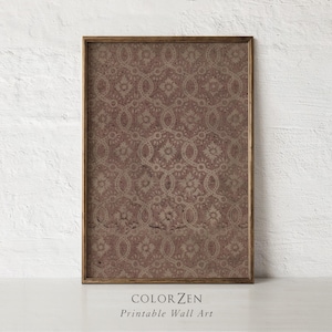 May include: Framed wall art featuring a vintage-style floral pattern in shades of brown and beige. The artwork is enclosed in a wooden frame and displays the text "COLOR ZEN Printable Wall Art" at the bottom. The overall aesthetic is reminiscent of antique textiles.