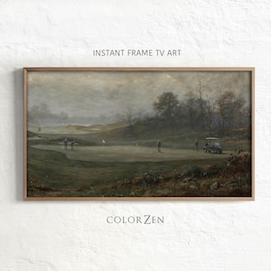 May include: A framed landscape print of a golf course in muted tones. The artwork features golfers, a golf cart, and a flag on the green. The text "INSTANT FRAME TV ART" and "COLOR ZEN" are visible.