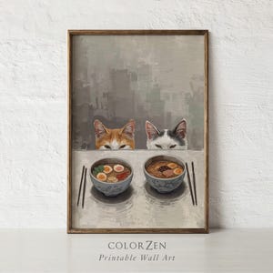 Puede incluir: Impresión artística de pared que muestra dos gatos mirando cuencos de ramen. La obra de arte tiene una paleta de colores neutros y un marco de madera. El texto "COLOR ZEN Printable Wall Art" está en la parte inferior.