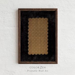 A framed printable wall art featuring an intricate golden lace pattern on a deep black background. The design is scalloped and ornate, showcasing delicate details that enhance its elegance. Ideal for home decor, this instant download adds sophistication to any space.