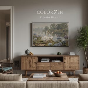 Cottagecore landscape painting styled in a cozy neutral nursery. Soft blue and white tones provide a calming mood. Perfect everyday nature gift for new parents decorating a modern home.