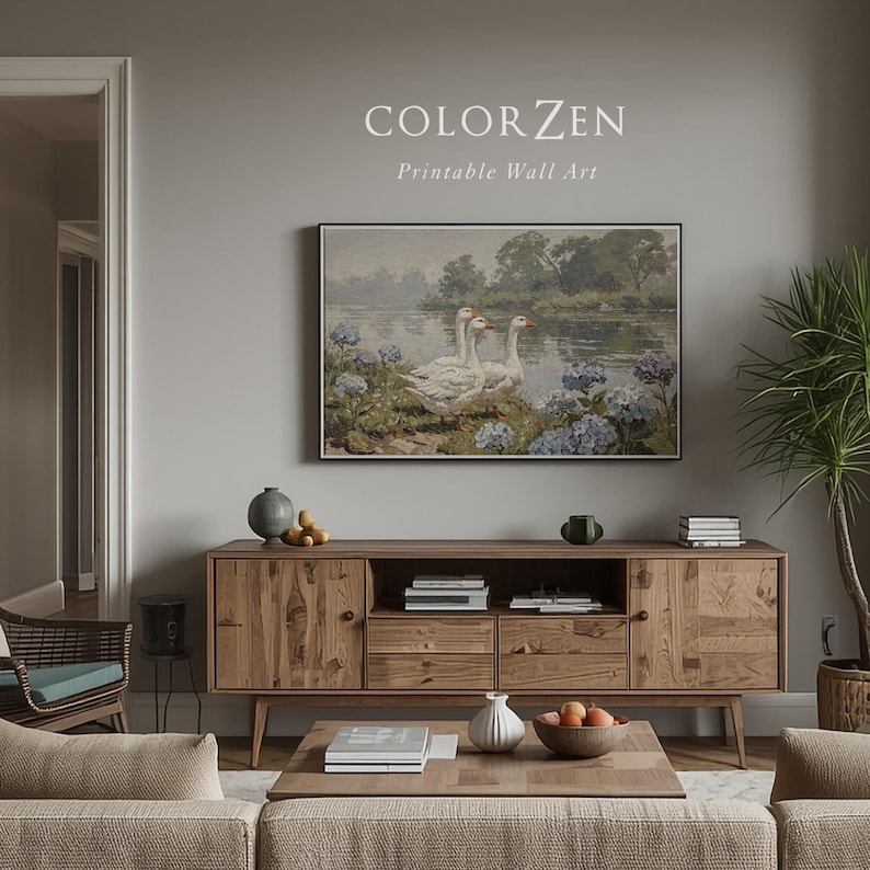 Cottagecore landscape painting styled in a cozy neutral nursery. Soft blue and white tones provide a calming mood. Perfect everyday nature gift for new parents decorating a modern home.