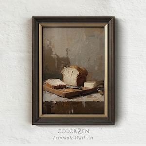 May include: Framed wall art featuring a still life of bread, butter, and a knife on a wooden cutting board. The artwork has a neutral color palette with brown and beige tones. The text "COLOR ZEN Printable Wall Art" is at the bottom.
