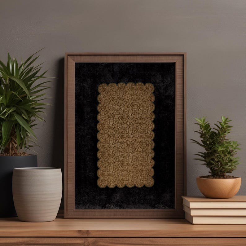 A cozy interior scene featuring printable wall art with a golden lace pattern framed in a modern wood frame. The artwork is set against a dark background, creating a warm and inviting atmosphere. Perfect for instant download, this piece enhances any living space.