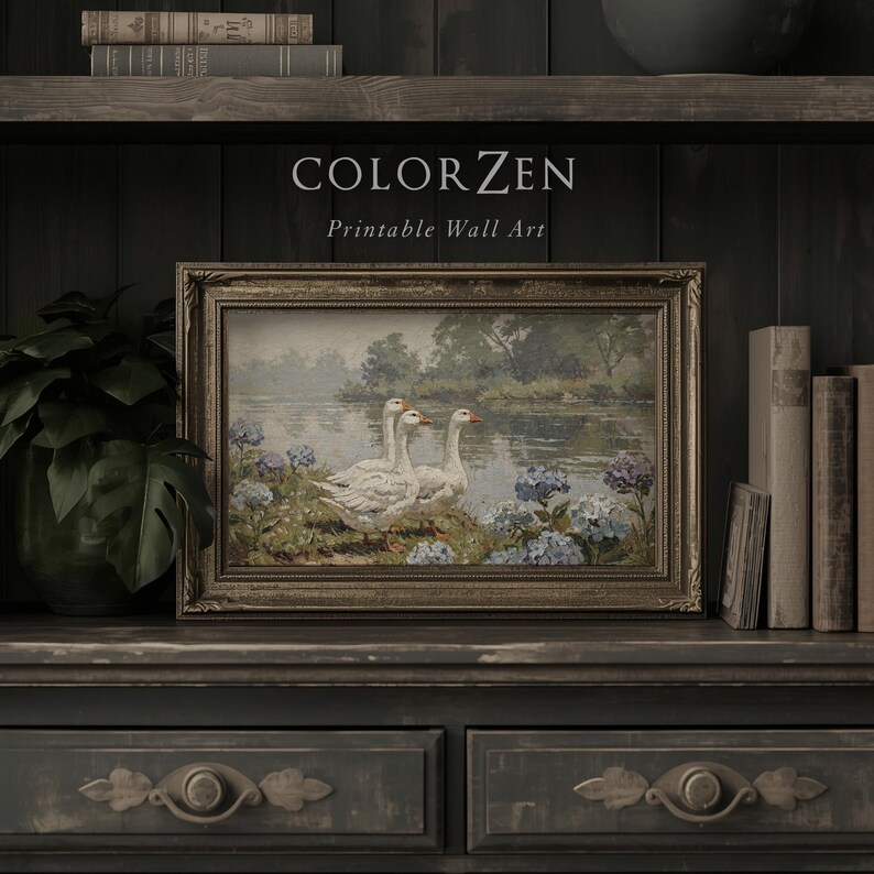 Detailed shot of blue cottagecore floral art print. Calm river backdrop with white geese. Rich oil paint texture ideal for a farmhouse kitchen or cozy entryway gallery wall, light or dark.