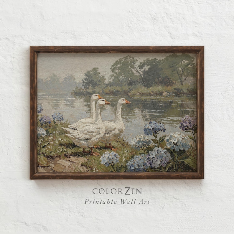 Digital download print framed on a modern shelf. Vintage geese and blue hydrangeas landscape. A versatile, all-season art piece that complements both rustic wood and sleek dark decor.