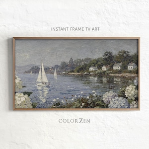 Pode incluir: Pintura emoldurada de uma paisagem costeira com veleiros na água. Casas brancas margeiam a costa e o céu está nublado. Os textos "INSTANT FRAME TV ART" e "COLORZEN" são visíveis.