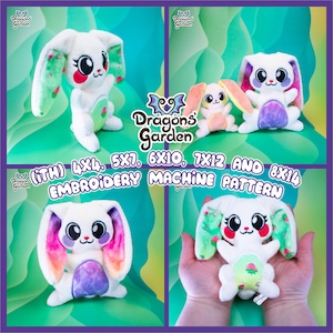 May include: A set of four embroidery machine patterns for a plush bunny toy. The patterns are available in four sizes: 4x4, 5x7, 6x10, 7x12, and 8x14 inches. The bunny is white with pink cheeks, green ears, and a rainbow-colored tail. The bunny is holding a strawberry in its paws.