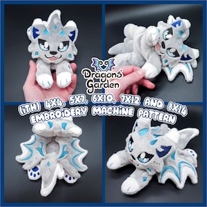 May include: Four embroidery machine patterns for a plush toy in various sizes: 4x4, 5x7, 6x10, 7x12, and 8x14 inches. The plush toy is a gray and blue wolf with a white belly and blue eyes. The patterns are from Dragons Garden.