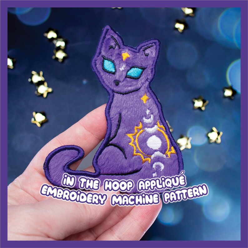 May include: A purple cat applique embroidery machine pattern with blue eyes, a yellow star, and a sun and moon design. The text "IN THE HOOP APPLIQUE EMBROIDERY MACHINE PATTERN" is displayed on a white banner.
