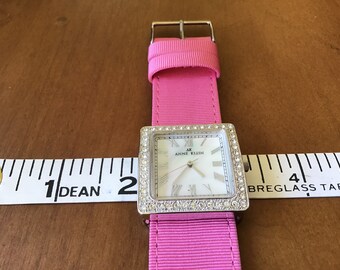 womans watch with charms of moon and stars