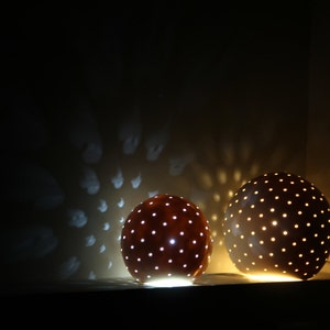 Porcelain lamp in the shape of a small sphere